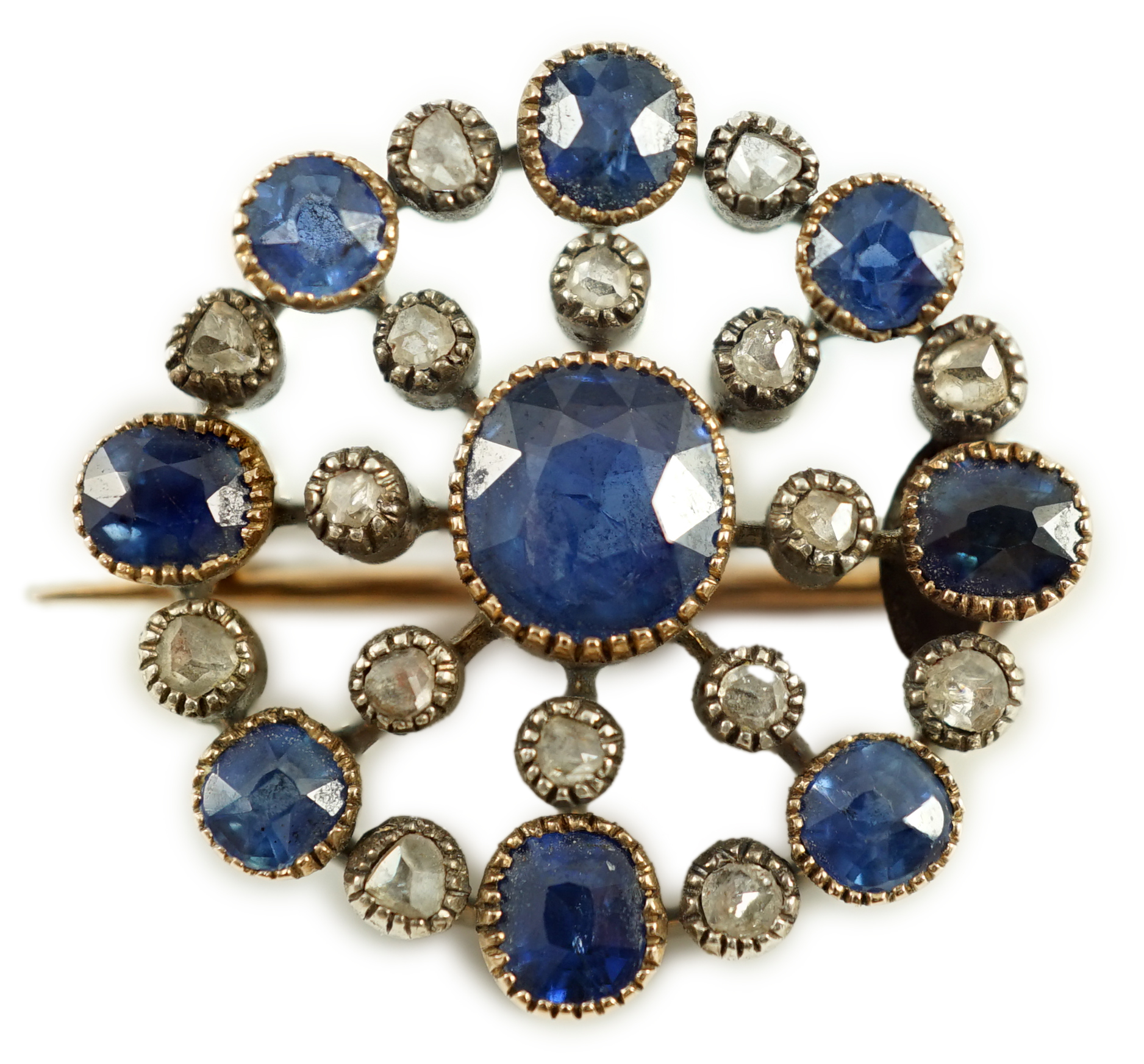 A Belle Epoque gold and silver, sapphire and diamond cluster set circular brooch